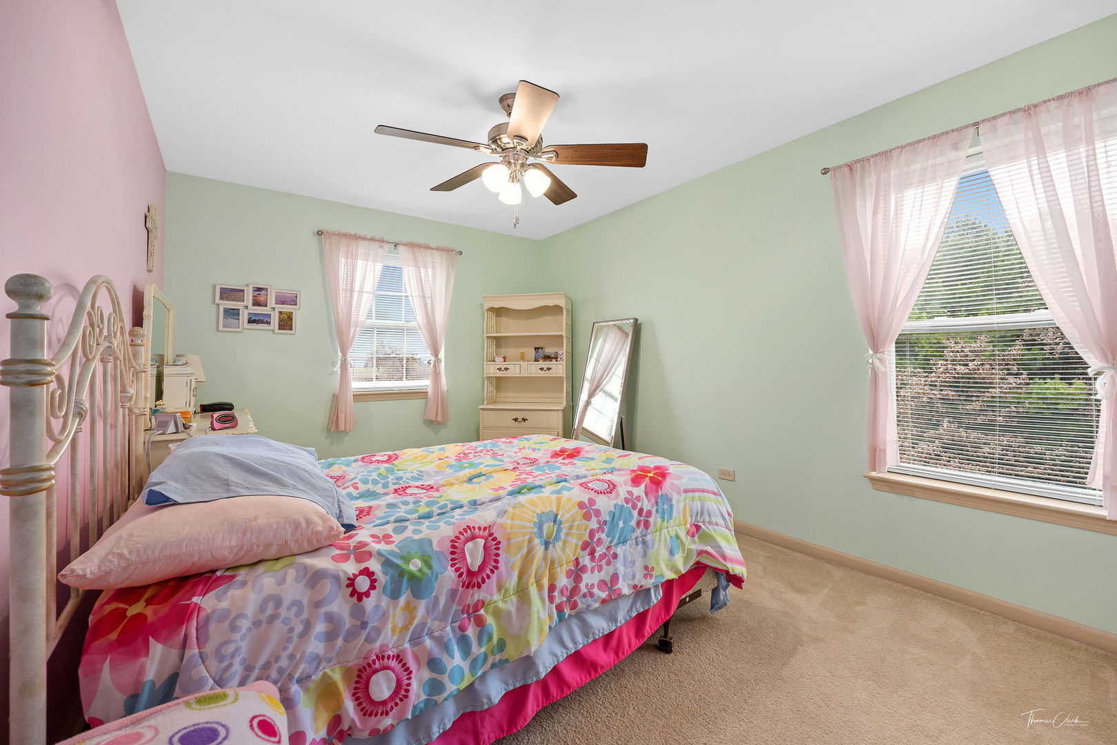 8022 West Offner Road Peotone, IL 60468 - Photo 32 of 42 a bedroom with a bed a chandelier and a window