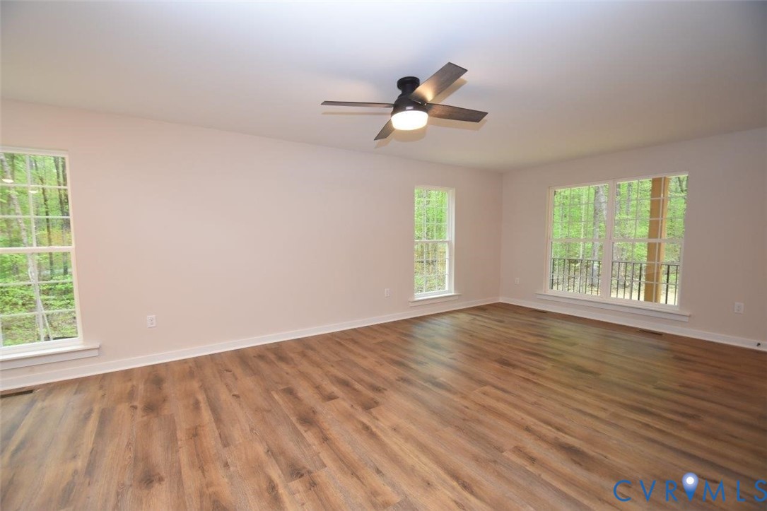 1749 Hollands Road Palmyra, VA 22963 - Photo 14 of 40 Empty room with wood finished floors and a ceiling
