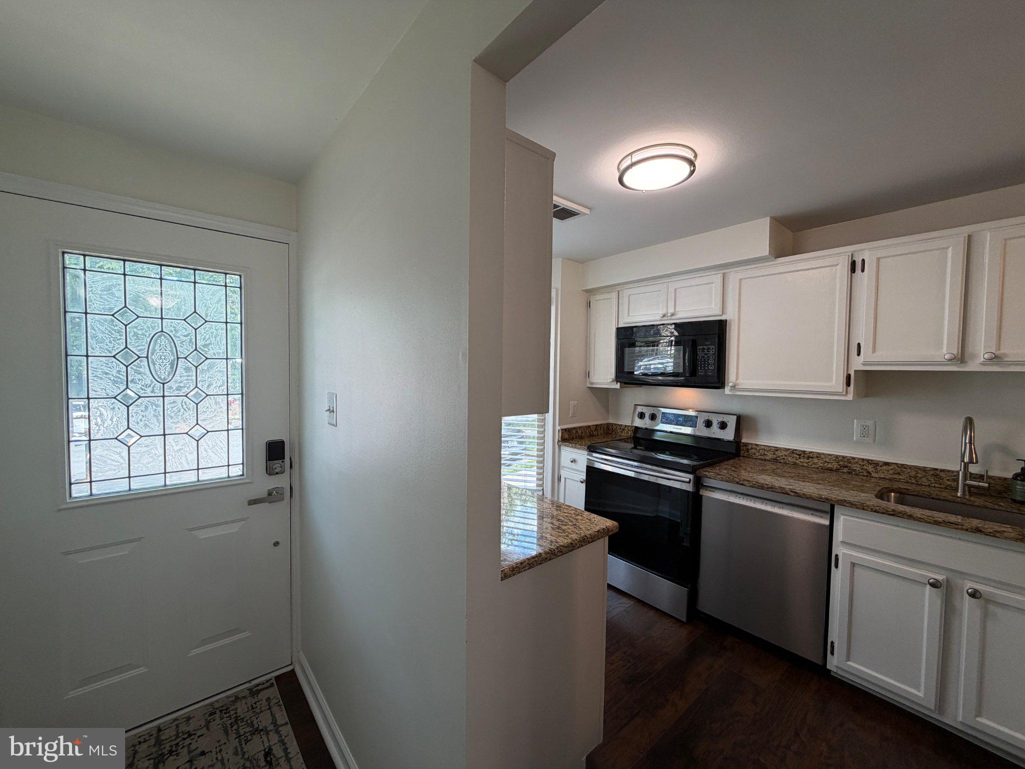 2121 Whisper Way Reston, VA 20191 - Photo 2 of 61 Inviting entry to modern kitchen space.