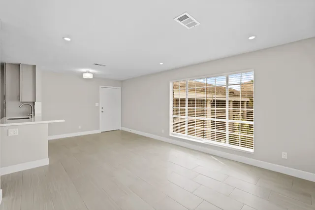 a bathroom with a toilet a sink and shower