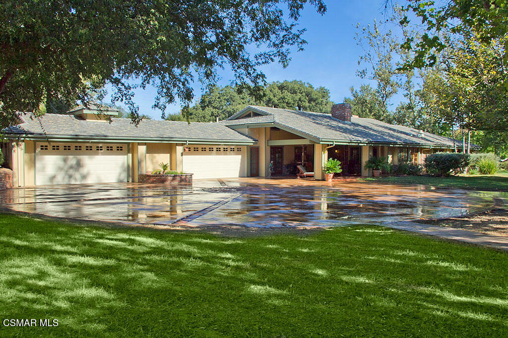 1812 West Potrero Road Thousand Oaks, CA 91361 - Photo 13 of 35 a front view of a house with a garden