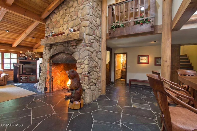 a view of an chairs and table in the balcony
