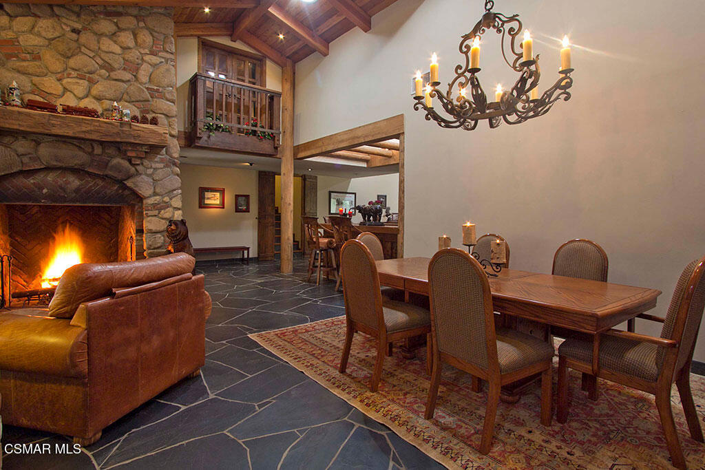 1812 West Potrero Road Thousand Oaks, CA 91361 - Photo 17 of 35 a living room with furniture a chandelier and a fireplace