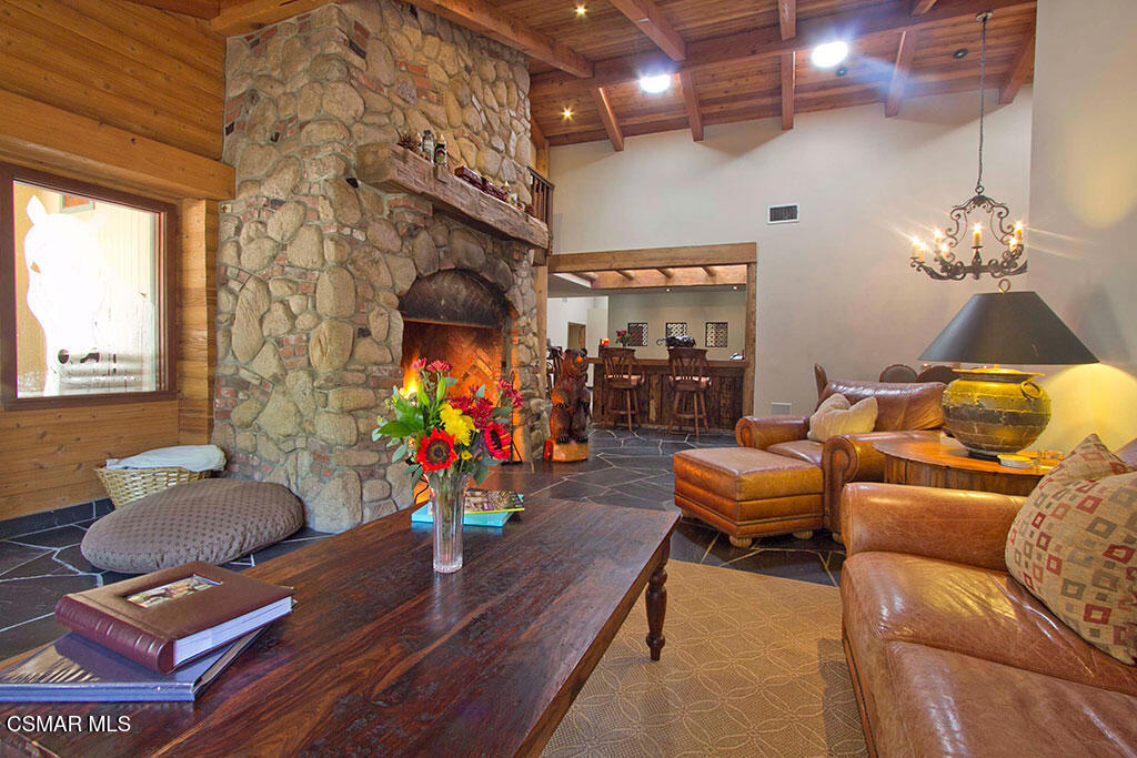 1812 West Potrero Road Thousand Oaks, CA 91361 - Photo 18 of 35 a living room with furniture and a chandelier