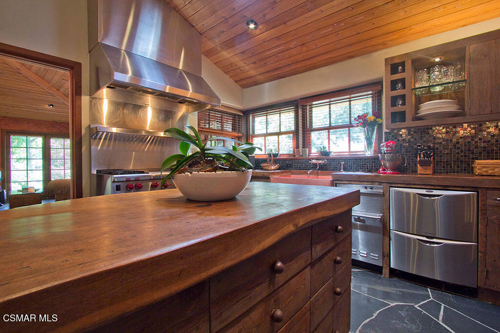 1812 West Potrero Road Thousand Oaks, CA 91361 - Photo 22 of 35 a kitchen with stainless steel appliances a sink dishwasher stove and refrigerator