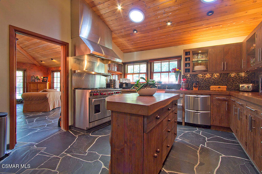 1812 West Potrero Road Thousand Oaks, CA 91361 - Photo 24 of 35 a kitchen with stainless steel appliances granite countertop a sink and a stove