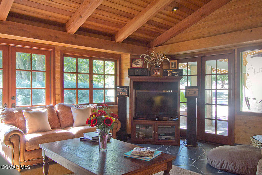 1812 West Potrero Road Thousand Oaks, CA 91361 - Photo 26 of 35 a living room with furniture and a flat screen tv