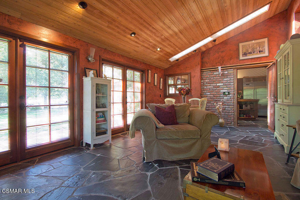 1812 West Potrero Road Thousand Oaks, CA 91361 - Photo 27 of 35 a living room with furniture and a floor to ceiling window