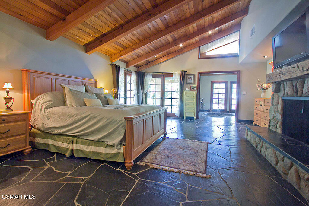 1812 West Potrero Road Thousand Oaks, CA 91361 - Photo 29 of 35 a bedroom with a balcony a bed and a dresser in it