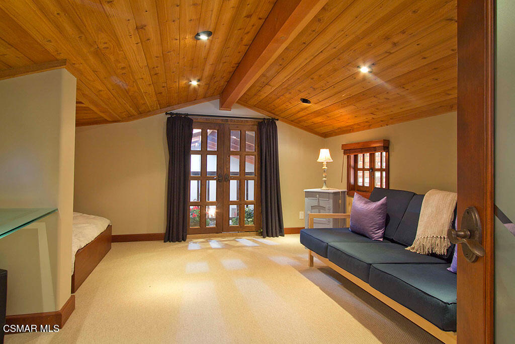 1812 West Potrero Road Thousand Oaks, CA 91361 - Photo 35 of 35 a spacious bedroom with a bed and a chandelier