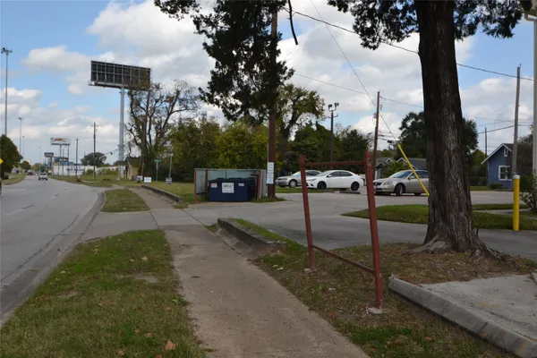 a view of a patio with table and chairs