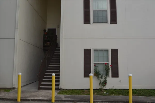 a view of a patio front of house