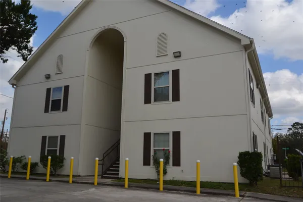 a view of a potted plants next to a yard