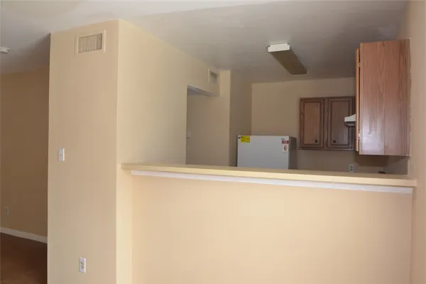 a view of cabinet with wooden floor