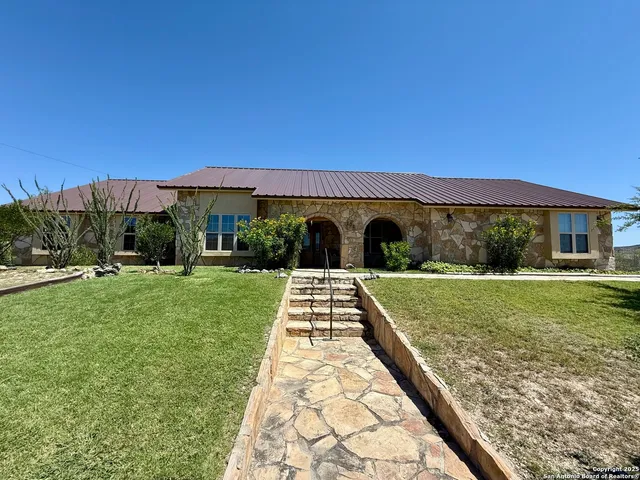 a view of a garden with a large tree
