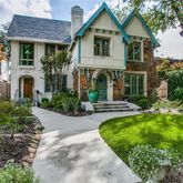 a front view of a house with a yard and porch