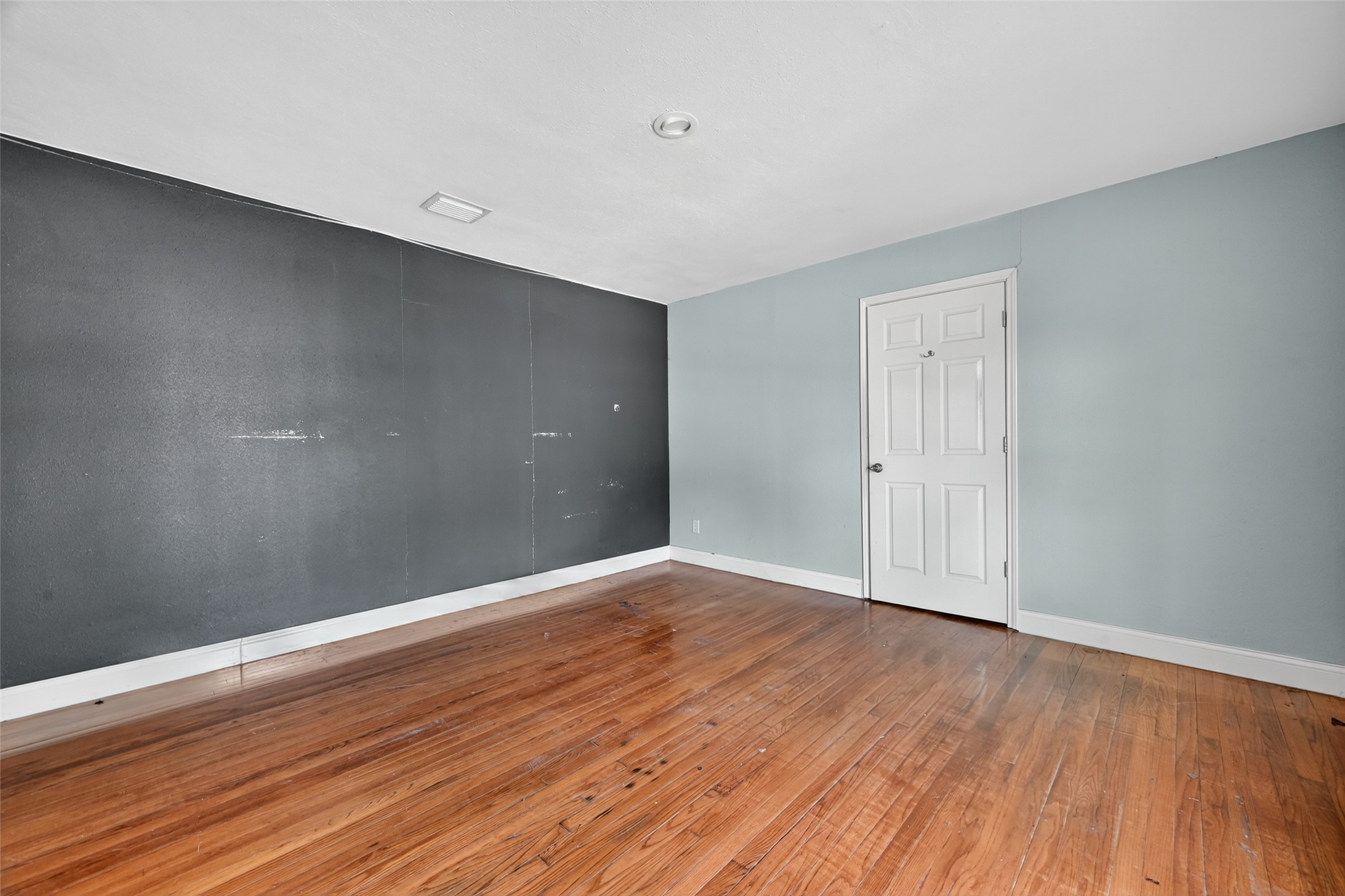 6434 Boothline Road Richmond, TX 77469 - Photo 22 of 36 a view of an empty room with wooden floor