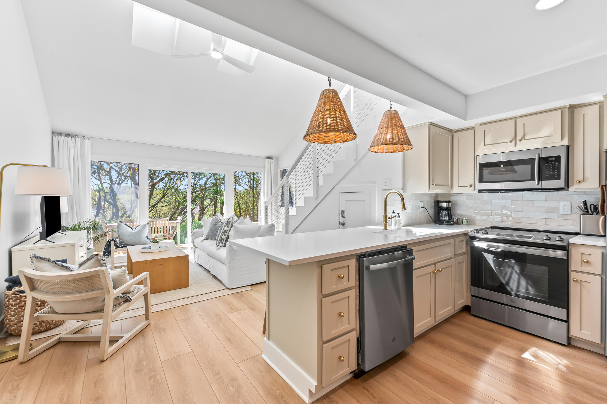 a kitchen with a sink stove and cabinets