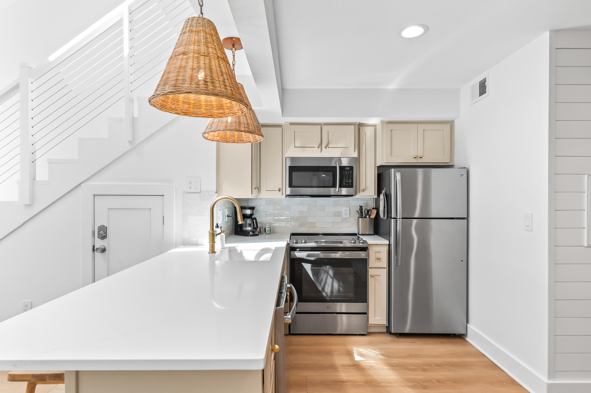 70 North Camp Creek Rd Inlet Beach, Unit 3 Inlet Beach, FL 32461 - Photo 15 of 66 a kitchen with stainless steel appliances a refrigerator a sink a stove and white cabinets