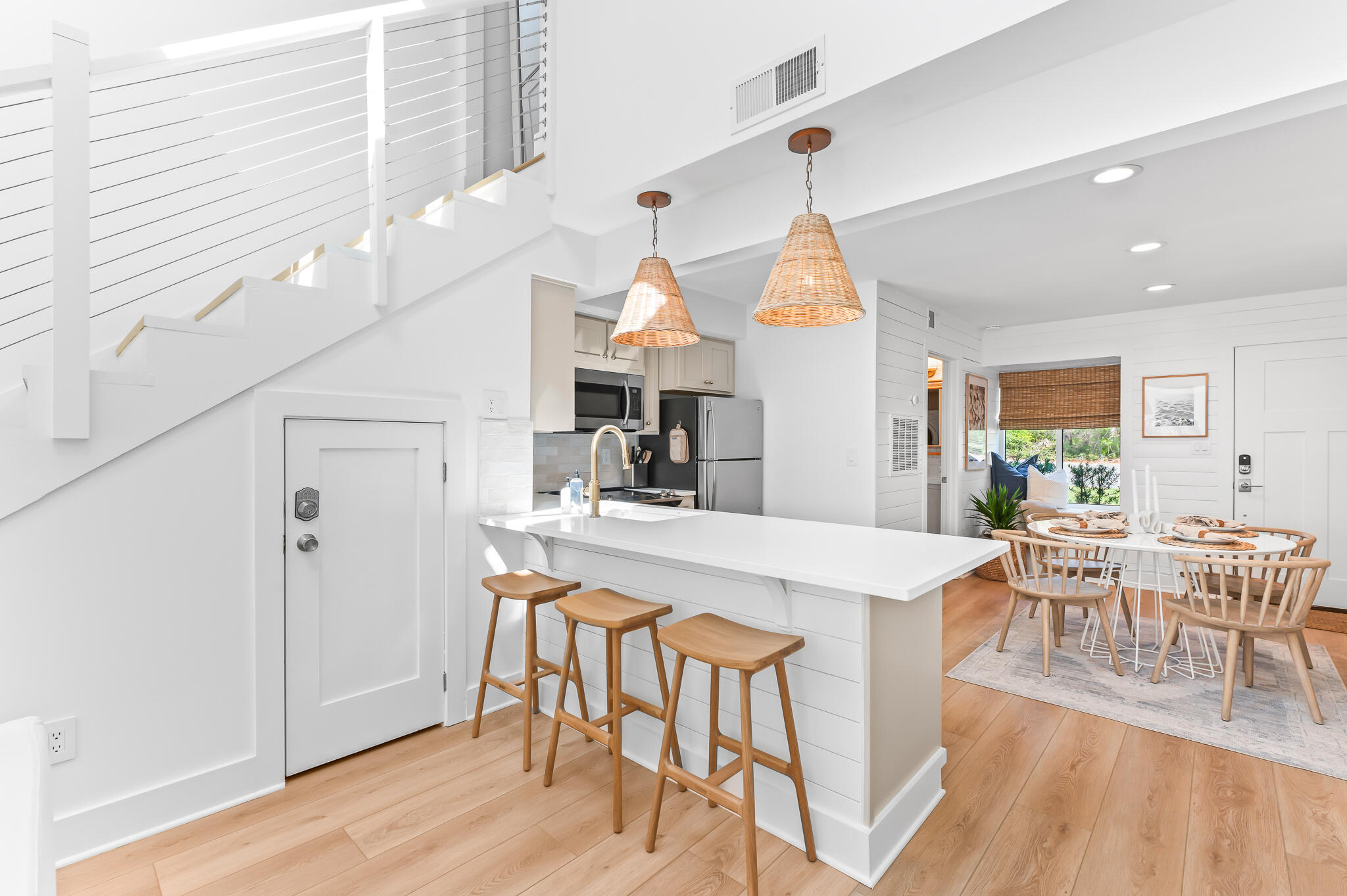 70 North Camp Creek Rd Inlet Beach, Unit 3 Inlet Beach, FL 32461 - Photo 17 of 66 a view of a dining room and livingroom with furniture wooden floor a chandelier