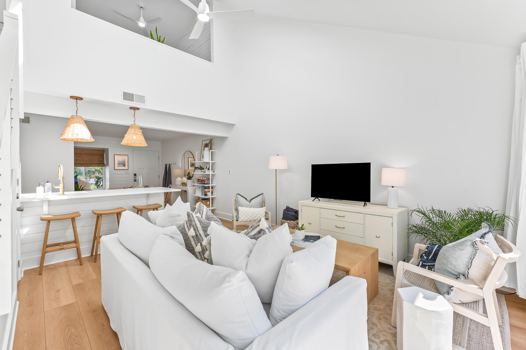 70 North Camp Creek Rd Inlet Beach, Unit 3 Inlet Beach, FL 32461 - Photo 20 of 66 a living room with furniture a flat screen tv and a fireplace