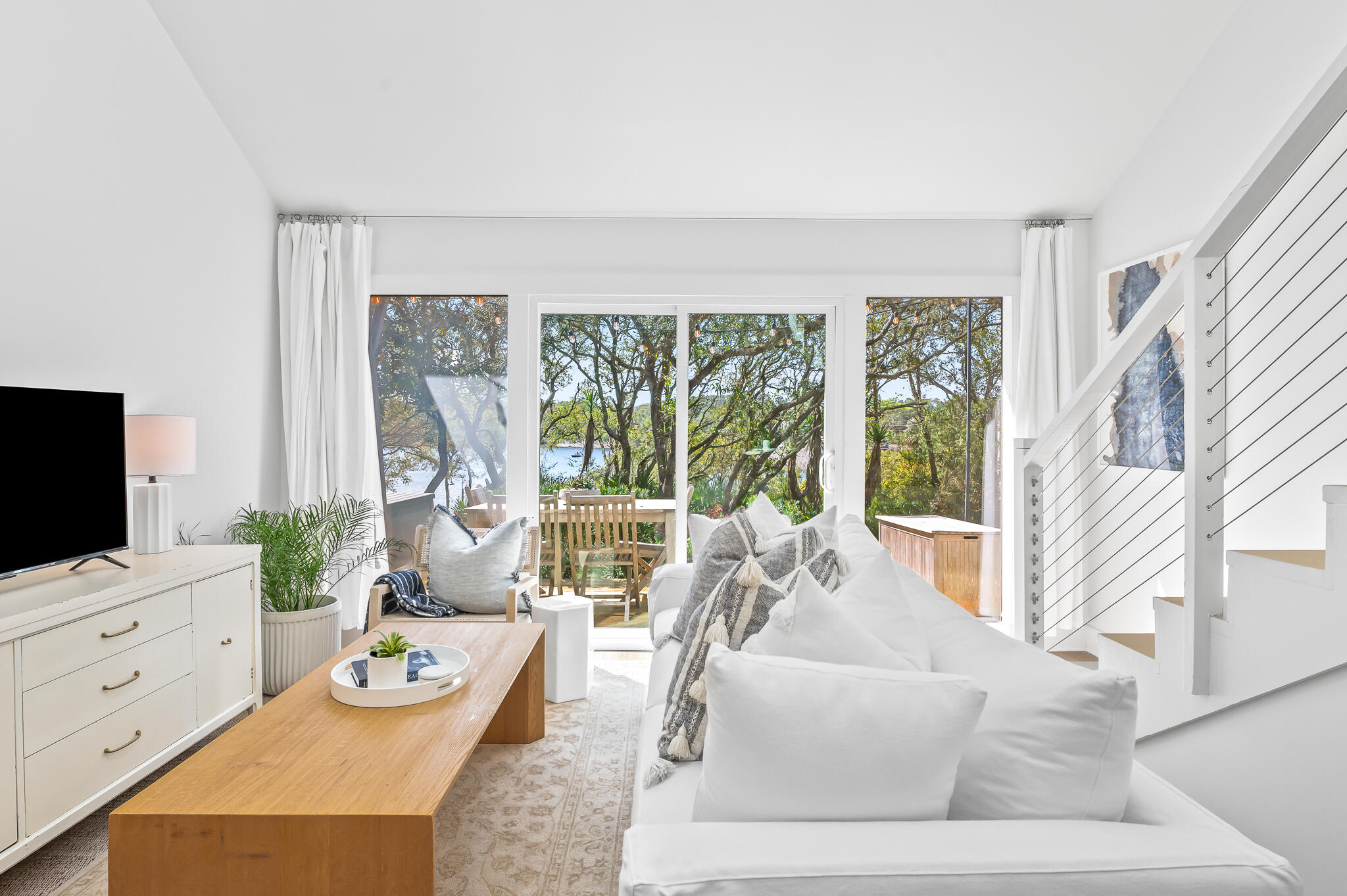 70 North Camp Creek Rd Inlet Beach, Unit 3 Inlet Beach, FL 32461 - Photo 25 of 66 a living room with furniture and a flat screen tv