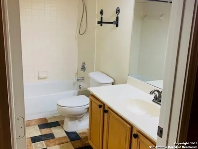 a bathroom with a sink and toilet