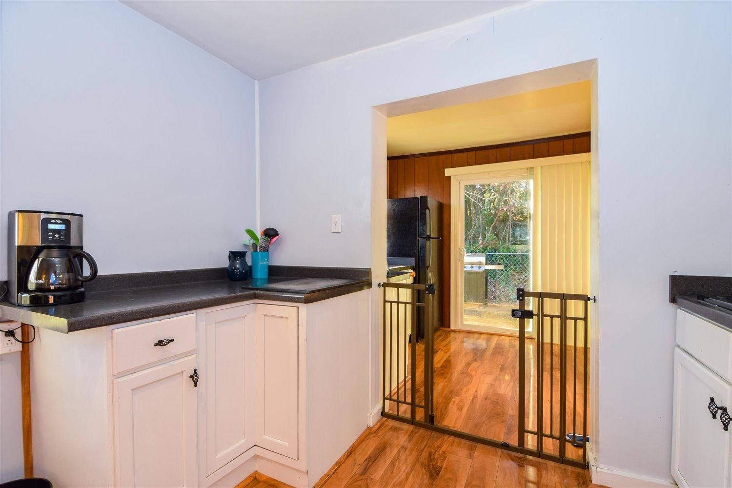 6306 Roberta Road Roanoke, VA 24019 - Photo 11 of 27 a kitchen with stainless steel appliances granite countertop a sink and a cabinets