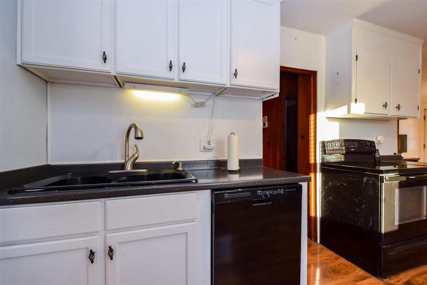 6306 Roberta Road Roanoke, VA 24019 - Photo 12 of 27 a kitchen with a sink and cabinets