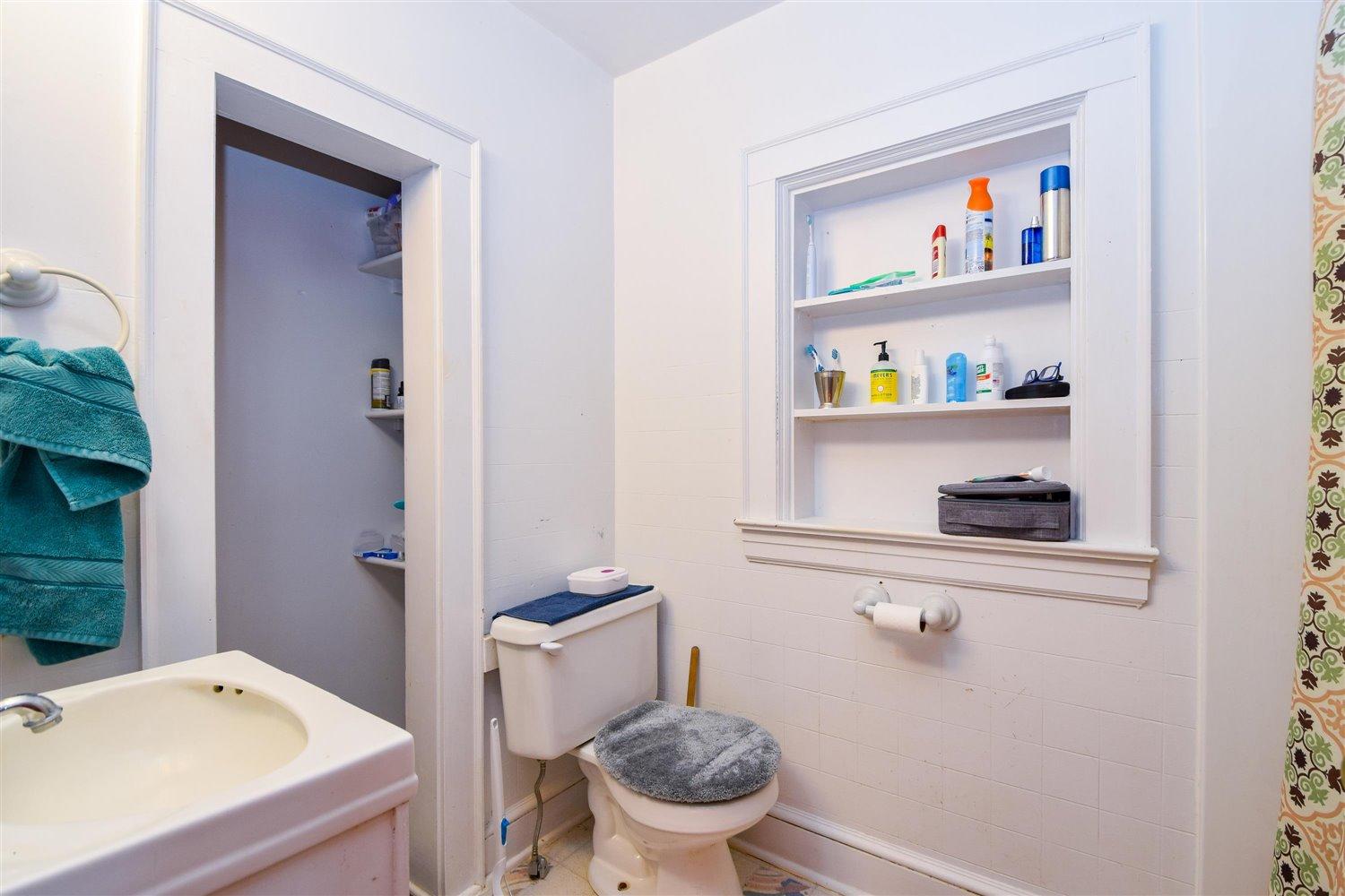 6306 Roberta Road Roanoke, VA 24019 - Photo 18 of 27 a bathroom with a sink a toilet and a shower curtain