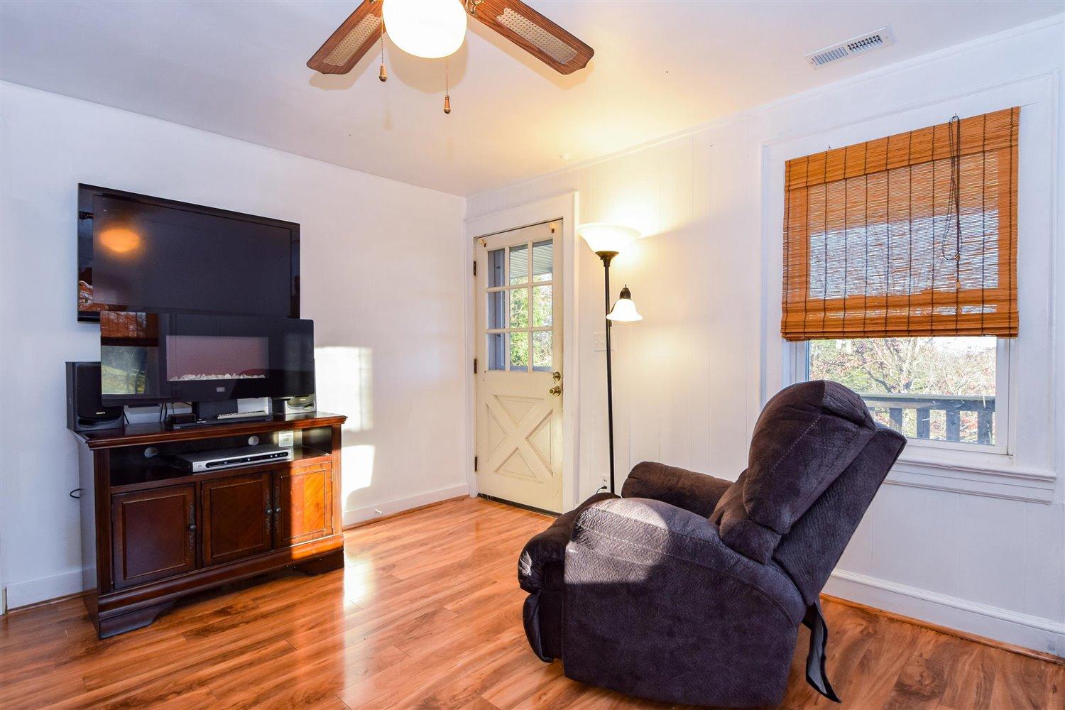 6306 Roberta Road Roanoke, VA 24019 - Photo 8 of 27 a living room with furniture and a flat screen tv
