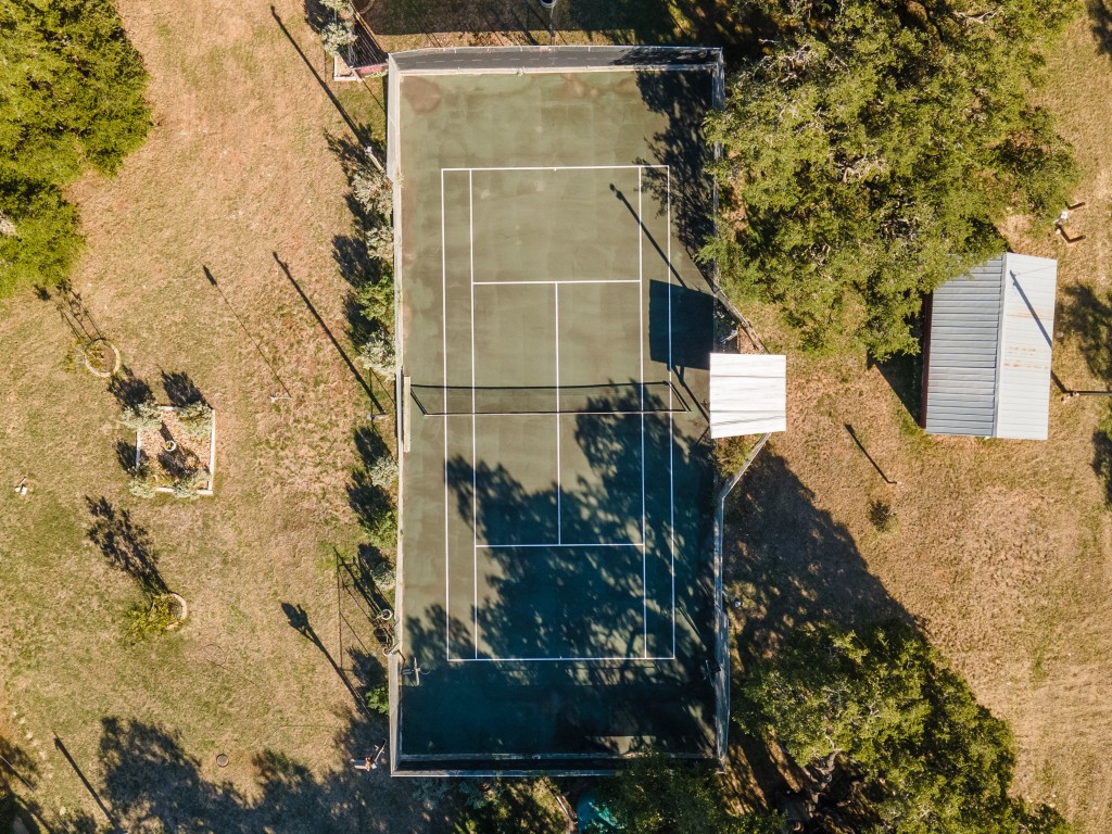 12737 Silver Creek Road Dripping Springs, TX 78620 - Photo 12 of 36 a bathroom with a shower