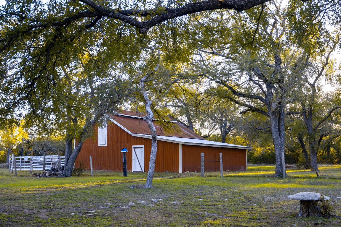 12737 Silver Creek Road Dripping Springs, TX 78620 - Photo 14 of 36 a view of a house with a yard