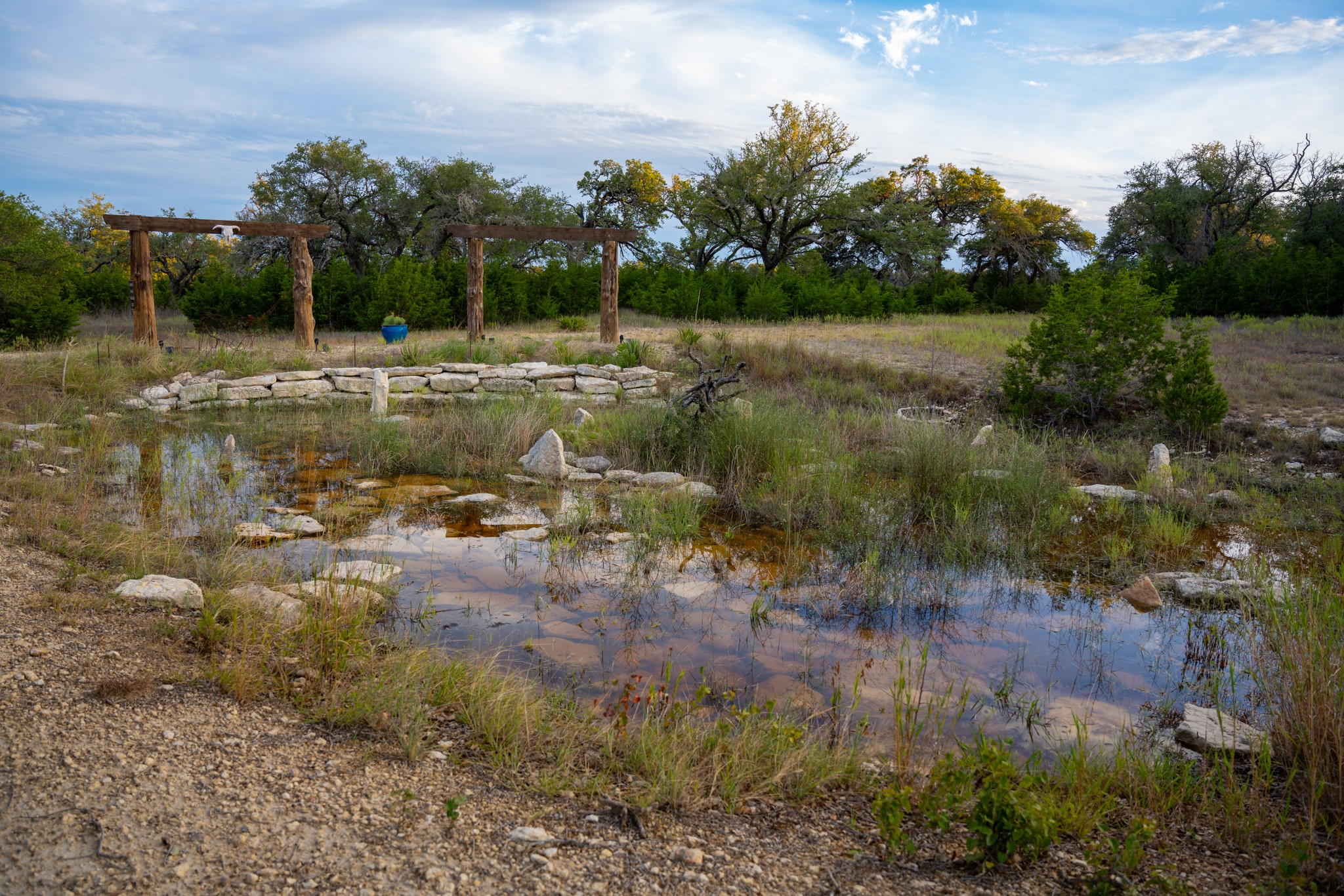 12737 Silver Creek Road Dripping Springs, TX 78620 - Photo 17 of 36 a view of a lake with green space
