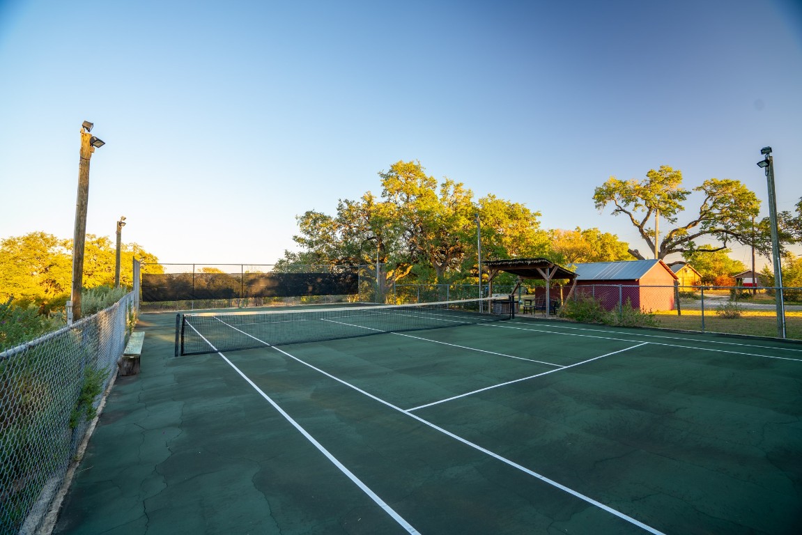 12737 Silver Creek Road Dripping Springs, TX 78620 - Photo 18 of 36 a view of a tennis court