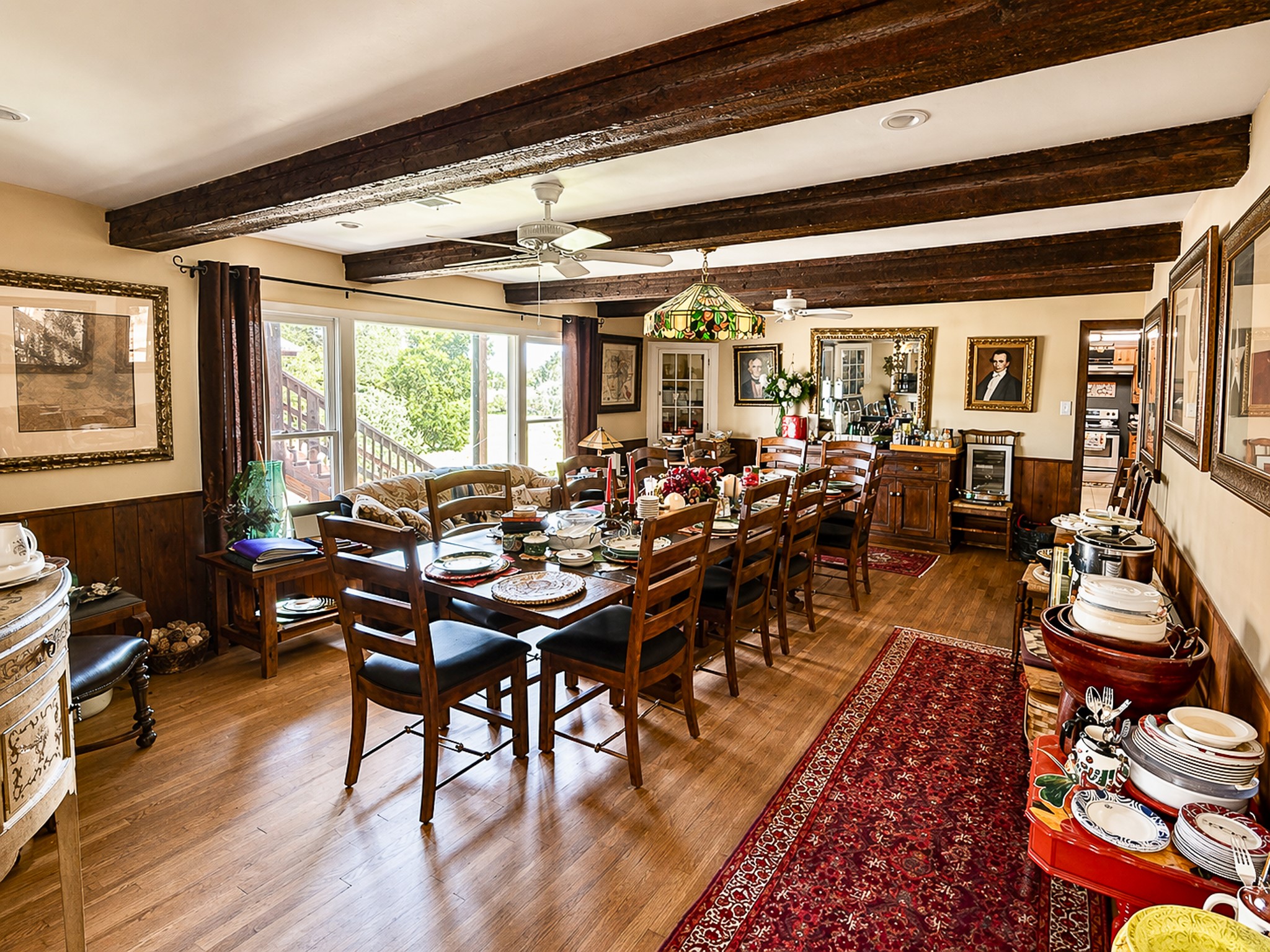 12737 Silver Creek Road Dripping Springs, TX 78620 - Photo 3 of 36 a view of a dining room with furniture window and wooden floor