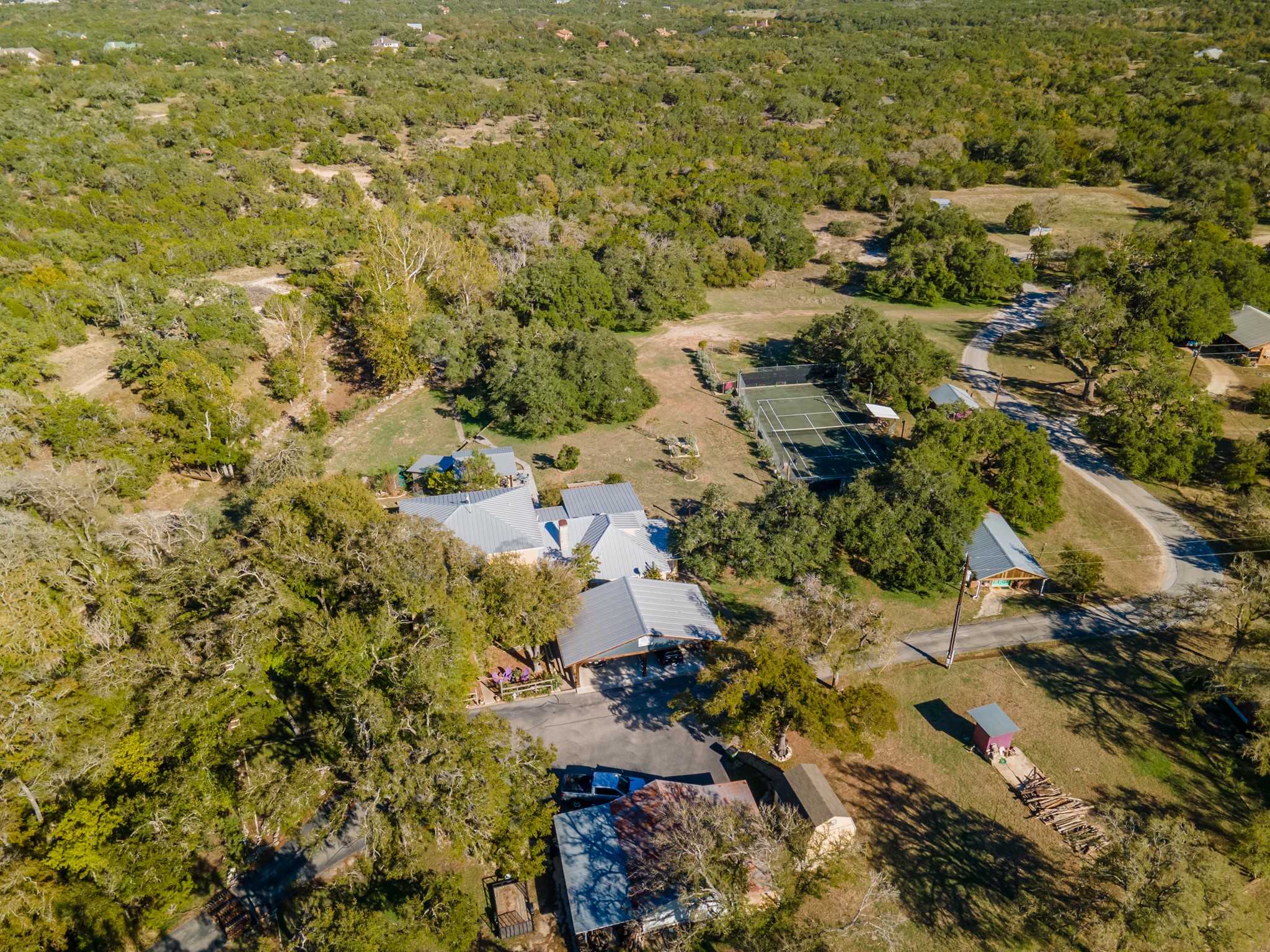 12737 Silver Creek Road Dripping Springs, TX 78620 - Photo 4 of 36 a view of residential houses with outdoor space
