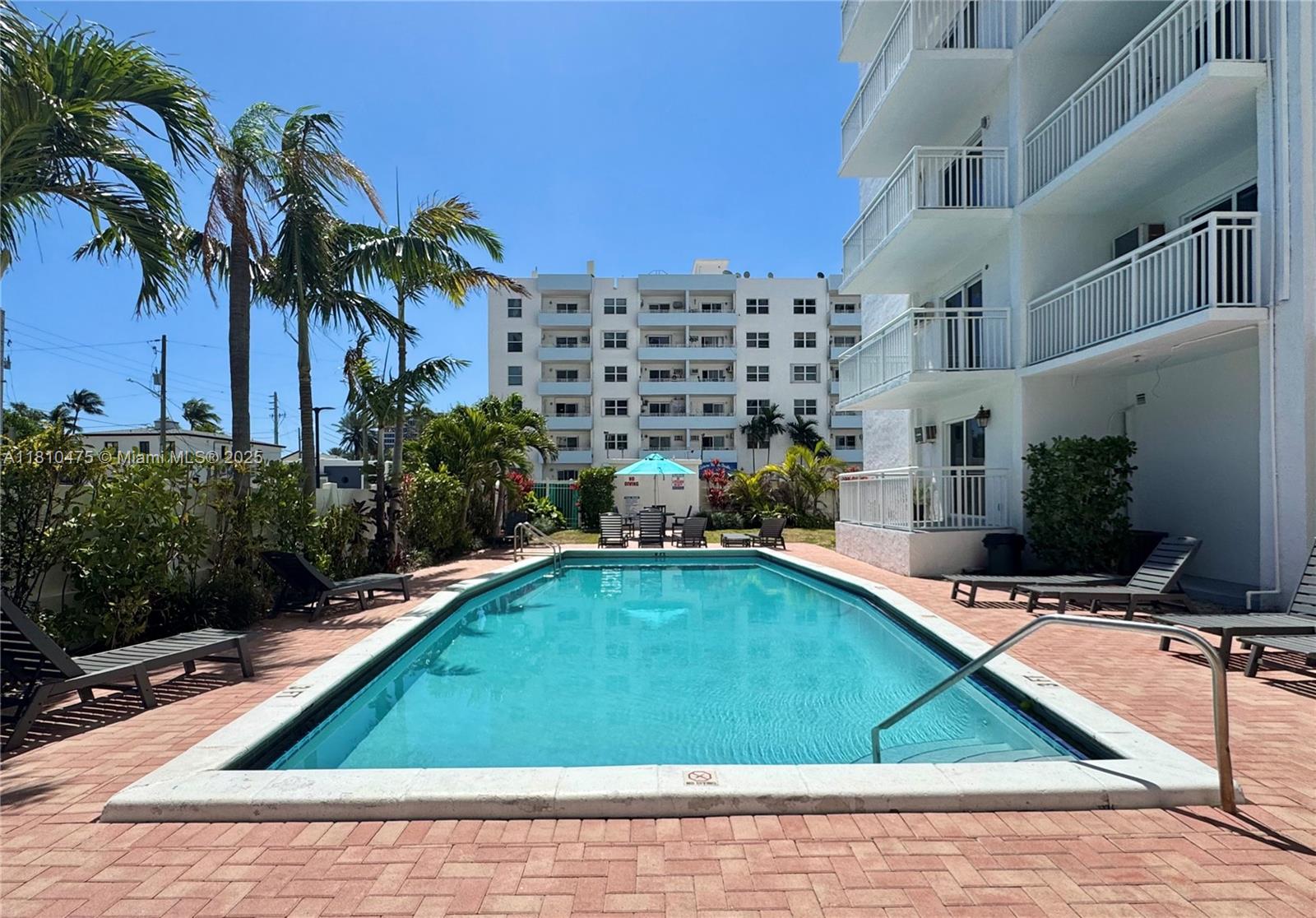 200 South Birch Road, Unit 304 Fort Lauderdale, FL 33316 - Photo 12 of 16 a small pool with lawn chairs and potted plants