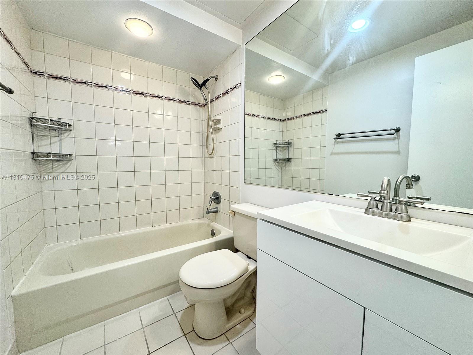 200 South Birch Road, Unit 304 Fort Lauderdale, FL 33316 - Photo 6 of 16 a bathroom with a sink a toilet and bathtub
