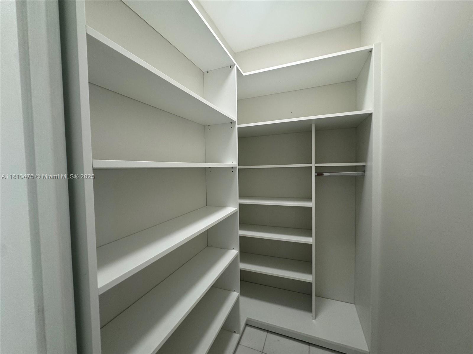 200 South Birch Road, Unit 304 Fort Lauderdale, FL 33316 - Photo 7 of 16 a view of walk in closet with empty racks