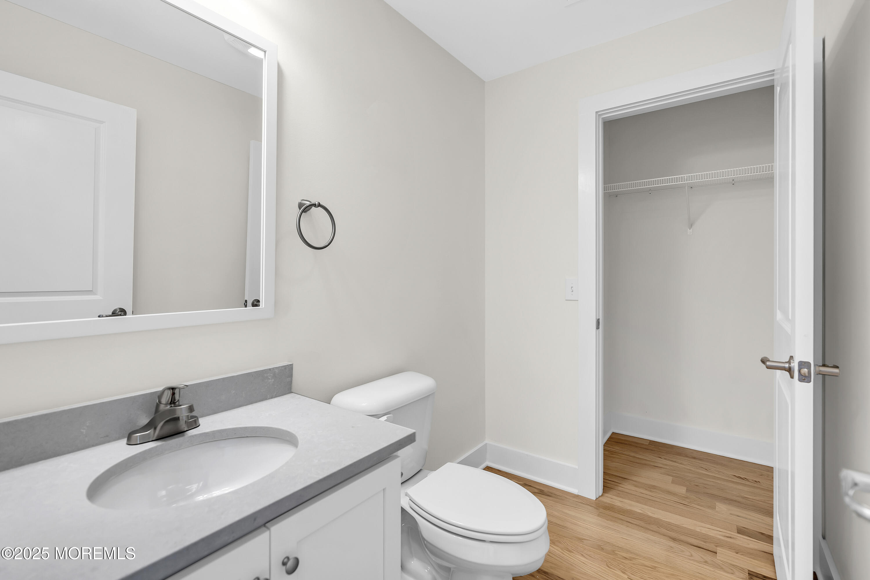 604 Ocean Road Point Pleasant, NJ 08742 - Photo 12 of 15 a bathroom with a sink toilet vanity and mirror