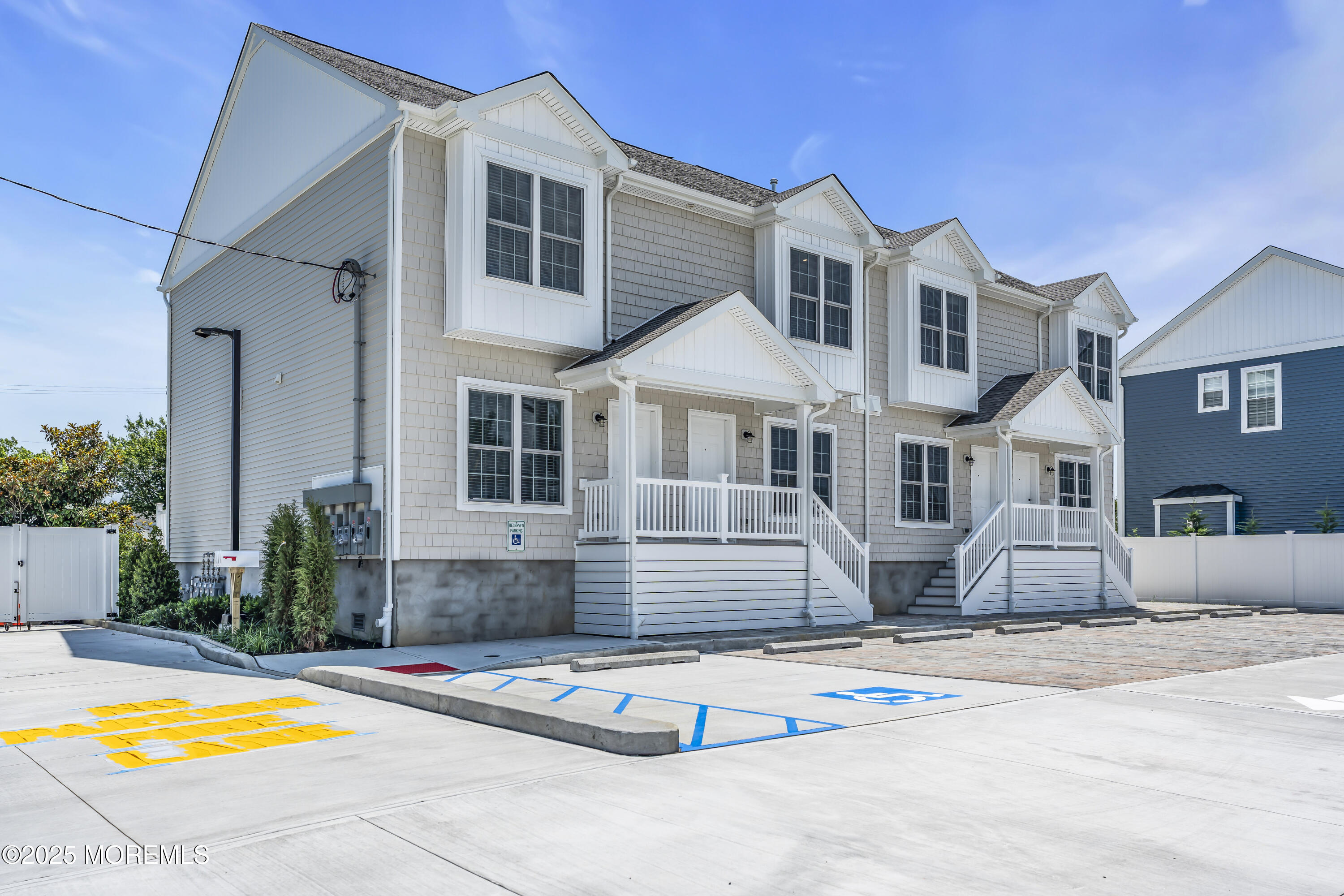 604 Ocean Road Point Pleasant, NJ 08742 - Photo 15 of 15 a view of a white house with swimming pool in front of it
