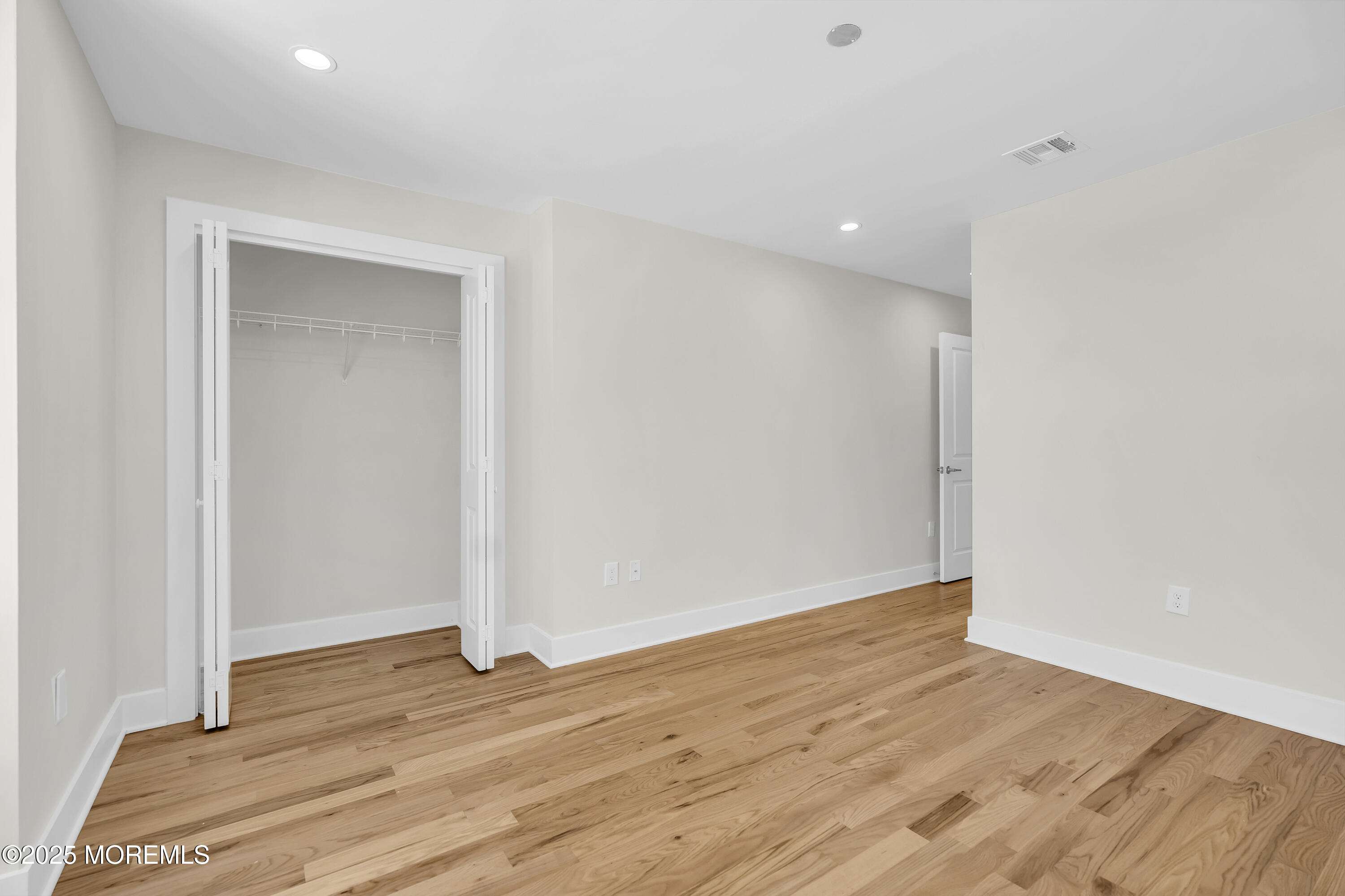 604 Ocean Road Point Pleasant, NJ 08742 - Photo 6 of 15 a view of empty room with wooden floor