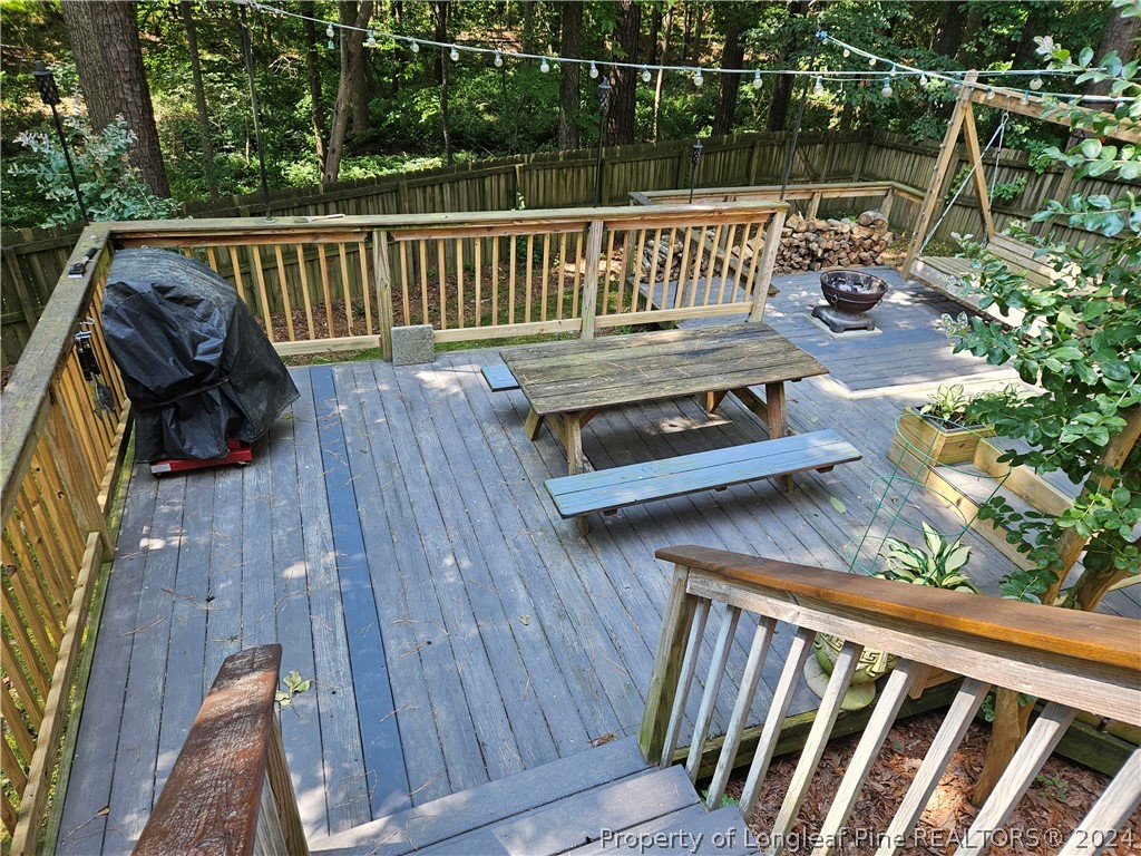 2825 Isabella Drive Raleigh, NC 27603 - Photo 13 of 31 a view of deck with chairs and wooden fence