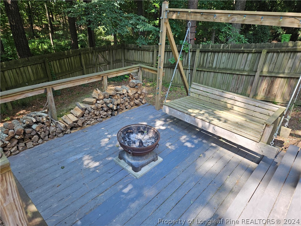 2825 Isabella Drive Raleigh, NC 27603 - Photo 16 of 31 a view of a deck with a wooden floor