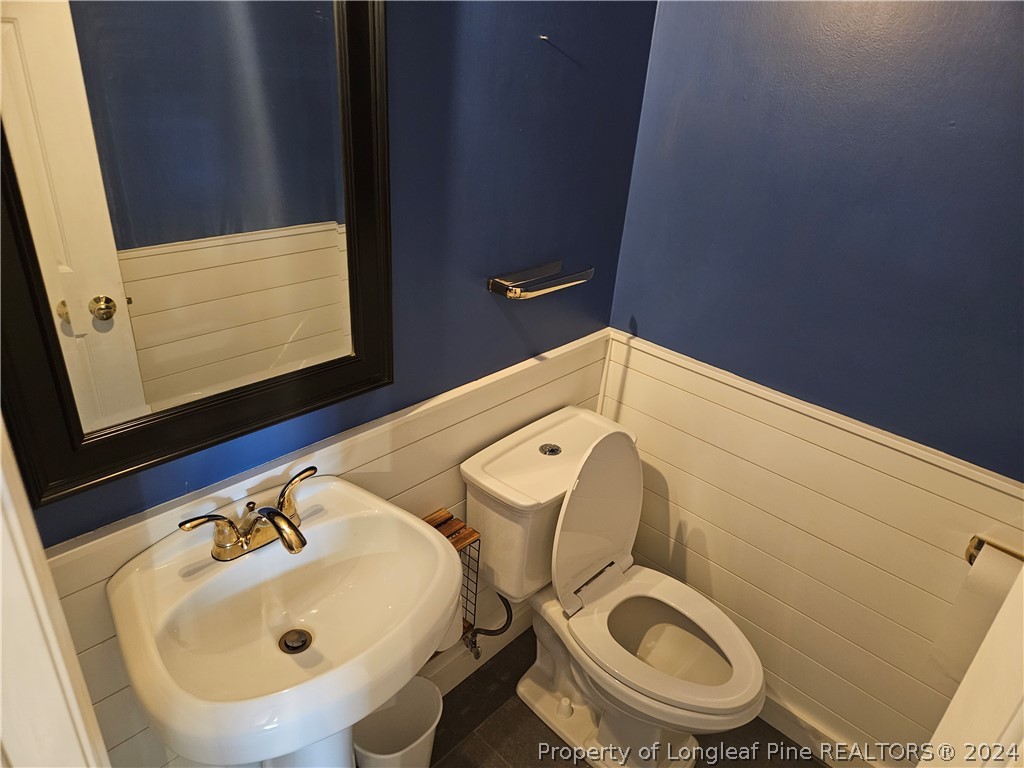 2825 Isabella Drive Raleigh, NC 27603 - Photo 18 of 31 a bathroom with a sink and a toilet