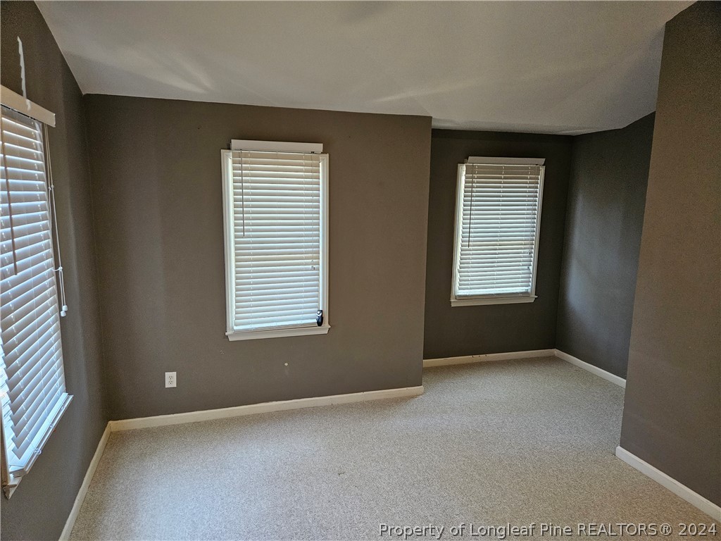 2825 Isabella Drive Raleigh, NC 27603 - Photo 20 of 31 an empty room with windows