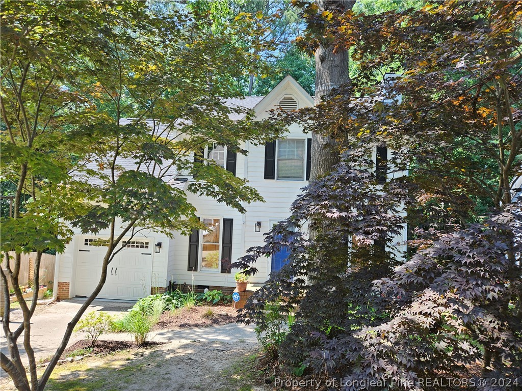 2825 Isabella Drive Raleigh, NC 27603 - Photo 2 of 31 a front view of a house with garden