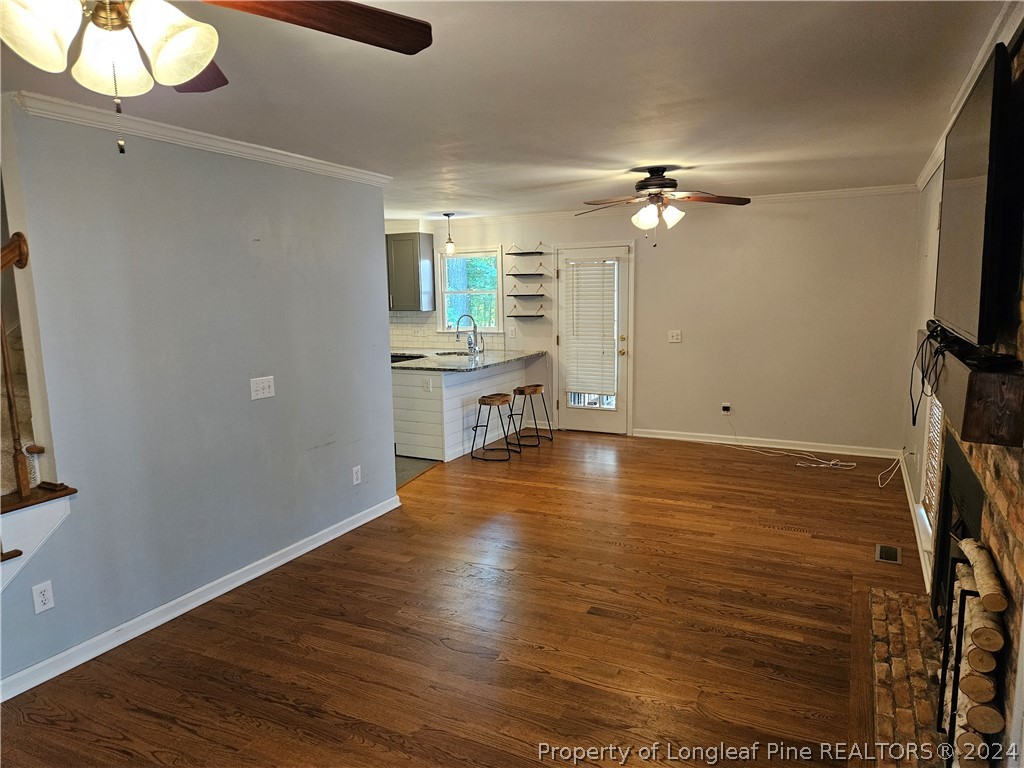 2825 Isabella Drive Raleigh, NC 27603 - Photo 5 of 31 wooden floor in an empty room with a window