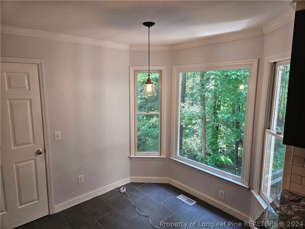 2825 Isabella Drive Raleigh, NC 27603 - Photo 8 of 31 a view of room with window and outdoor space